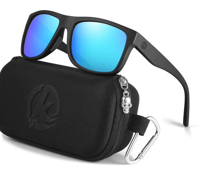 Black sunglasses with blue lenses on a black carrying case with a carabiner, on a white background.