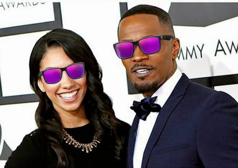 Two people wearing purple sunglasses