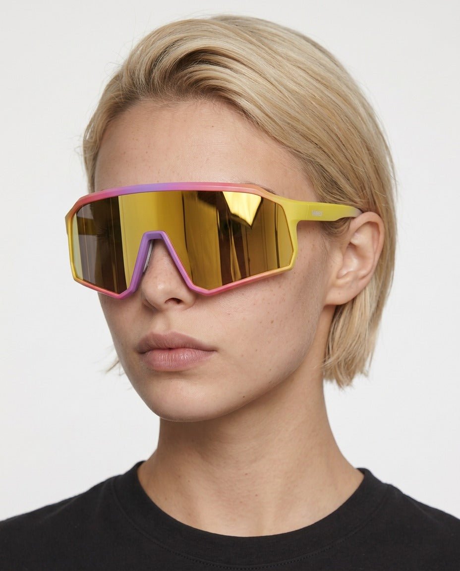 Brooklyn sport shield sunglasses in Grey / Yellow, grey lens on yellow frame, worn by a woman, front view