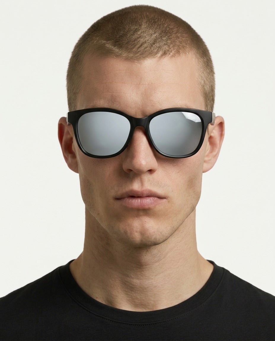 Delta 9 oversized round sunglasses in Grey / Black, grey lens on black frame, worn by a man, front view