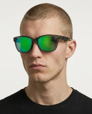 Delta 9 oversized round sunglasses in Green / Smoke Grey, green lens on smoke grey frame, worn by a man, front view