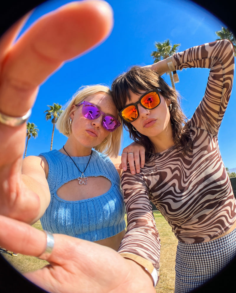 Fisheye festival selfie of two friends in Vibes Loft and Vibes Marlow sunglasses
