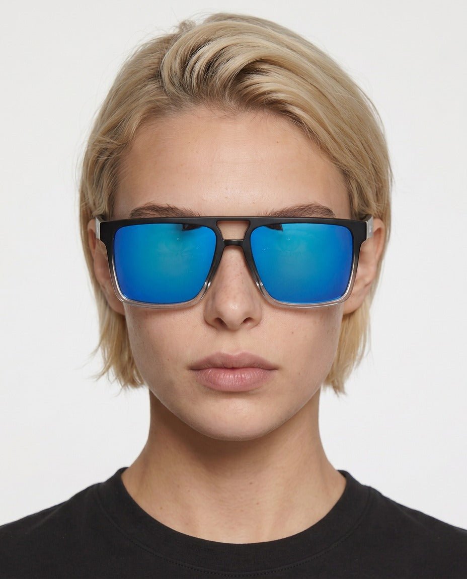 Sasha flat-top square sunglasses in Blue / Black/Clear, blue lens on black/clear frame, worn by a woman, front view