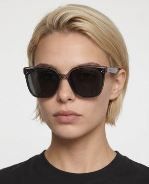 Vesper oversized square sunglasses in Black / Smoke Grey, black lens on smoke grey frame, worn by a woman, front view