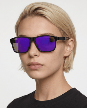 Delmar flat-top square sunglasses in Purple / Black, purple lens on black frame, worn by a woman, front view