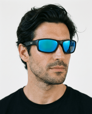 Nova sport wrap sunglasses in Blue / Black, blue lens on black frame, worn by a man, front view