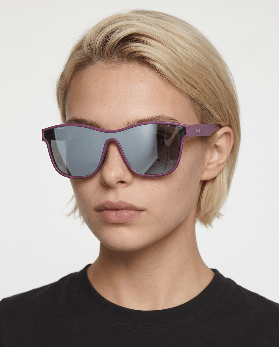 Radar performance wrap sunglasses in Silver / Purple, silver lens on purple frame, worn by a woman, front view