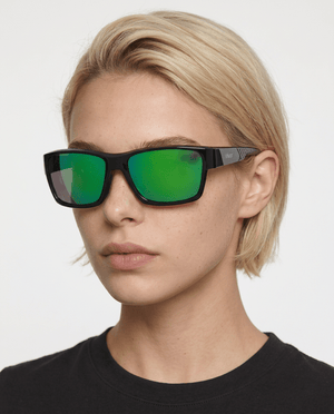 Specter slim wrap sunglasses in Green / Black, green lens on black frame, worn by a woman, front view