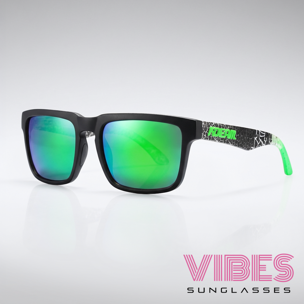 Black sunglasses with green reflective lenses on a white background, featuring the brand 'Vibes'.